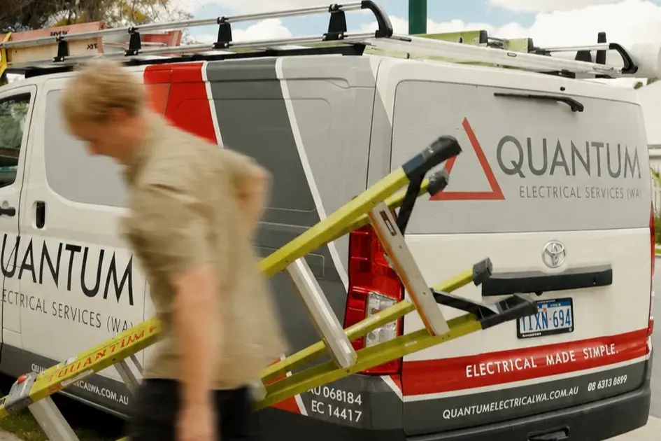 Quantum electrician installing and connecting a wall oven in a new kitchen